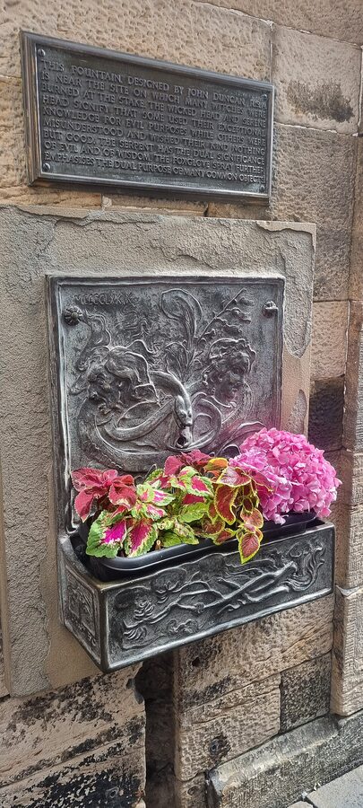 Witches Well plaque close-up Edinburgh Castle Esplanade