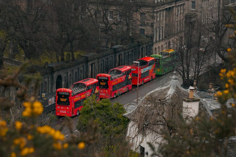 Double decker hop-on hop-off buses on an Edinburgh street