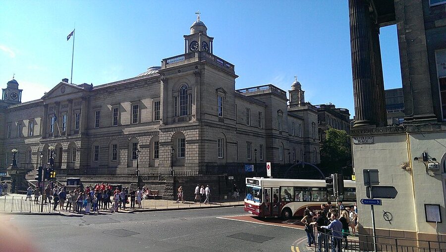 Edinburgh open top bus tour passengers on the upper deck