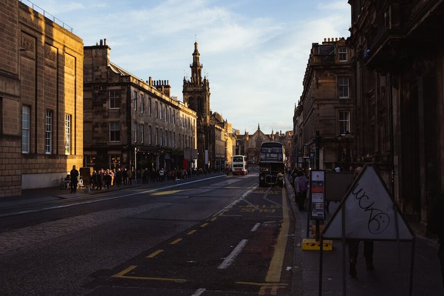 Edinburgh street at sunset with classic double decker bus