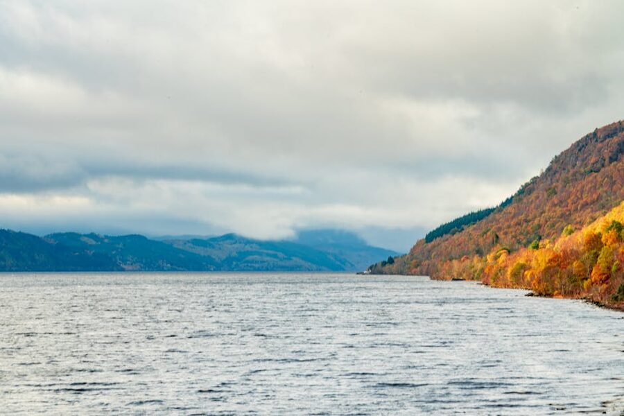 Loch Ness shore in autumn with dramatic skies