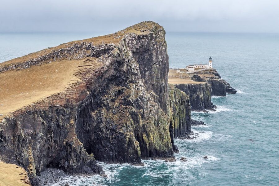 Neist Point Lighthouse on rocky cliffs Isle of Skye