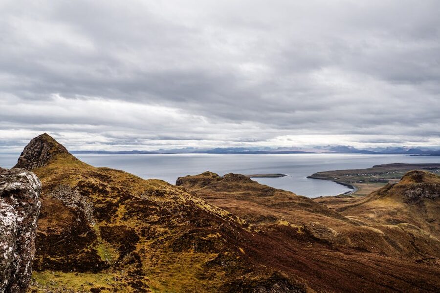 Rugged coastline of the Isle of Skye under cloudy sky