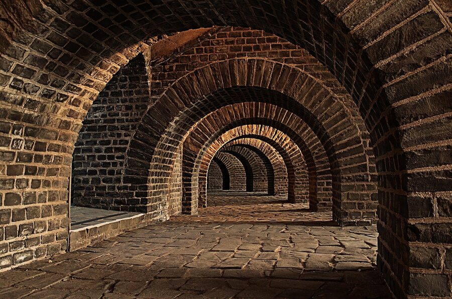 Vaulted stone cellar with arches