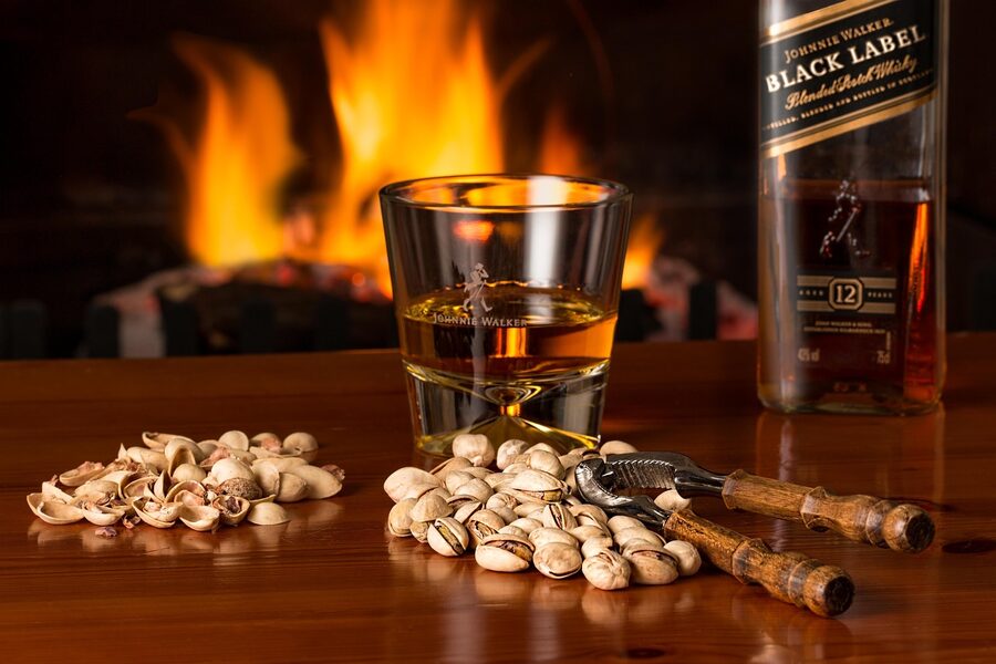 Whisky dram beside fireplace Edinburgh winter