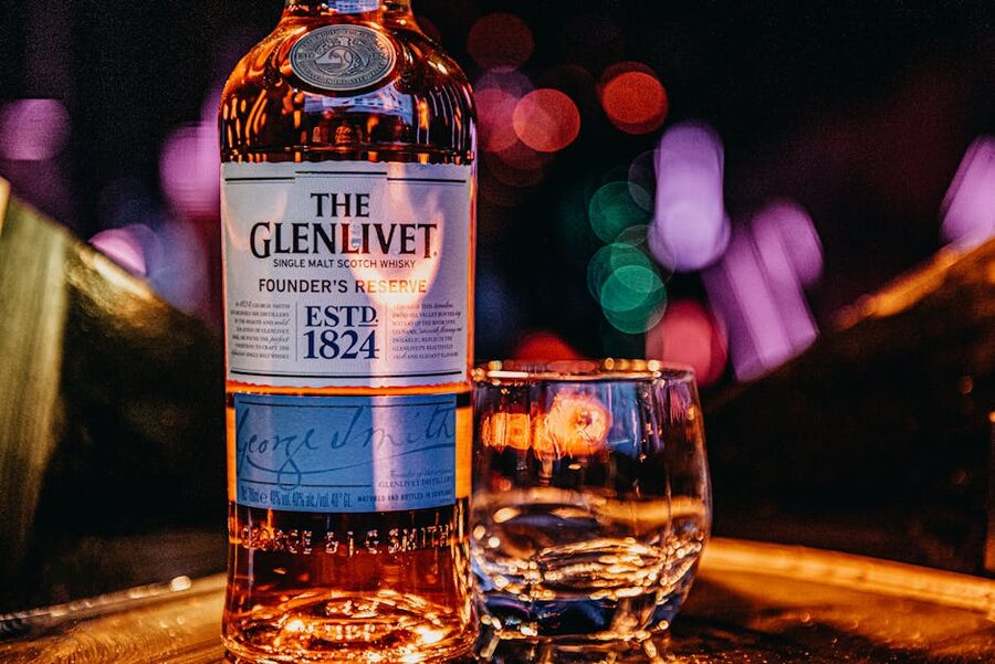 Whisky bottle and glass with bokeh light Edinburgh