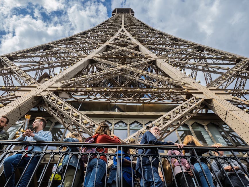 Looking up at Eiffel Tower iron lattice from viewing deck