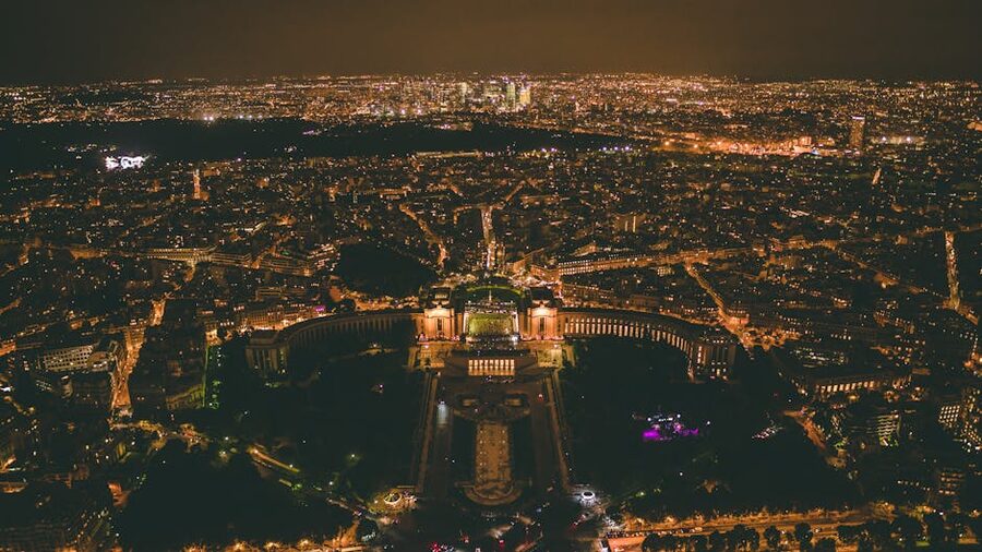 Paris city lights at night aerial view