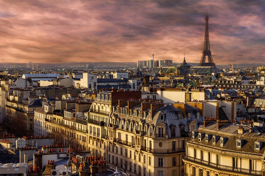 Eiffel Tower at night with Paris city lights