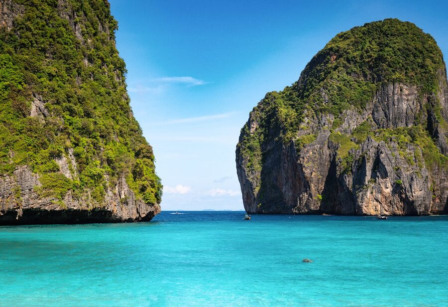Emerald green waters surrounded by limestone cliffs in the Andaman Sea