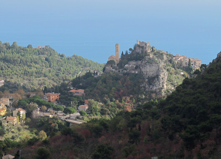 Eze village viewed from across the bay with houses tumbling down the hillside