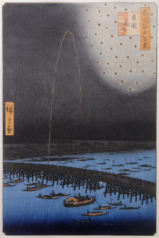 Historic ukiyo-e print showing fireworks over Ryogoku Bridge on the Sumida River with pleasure boats