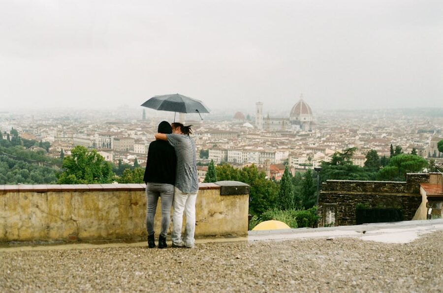Couple under an umbrella with Florence view