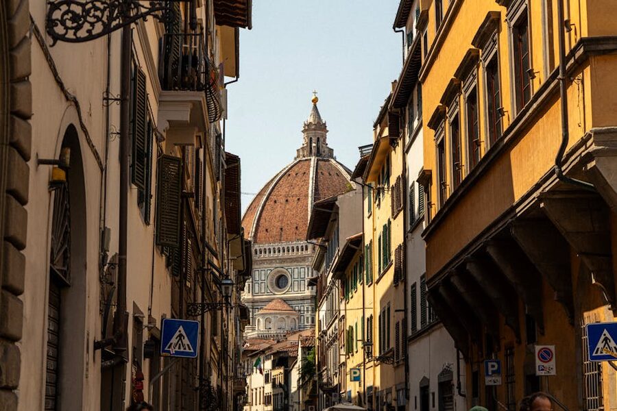 Historic Florence street with the Duomo dome in the background