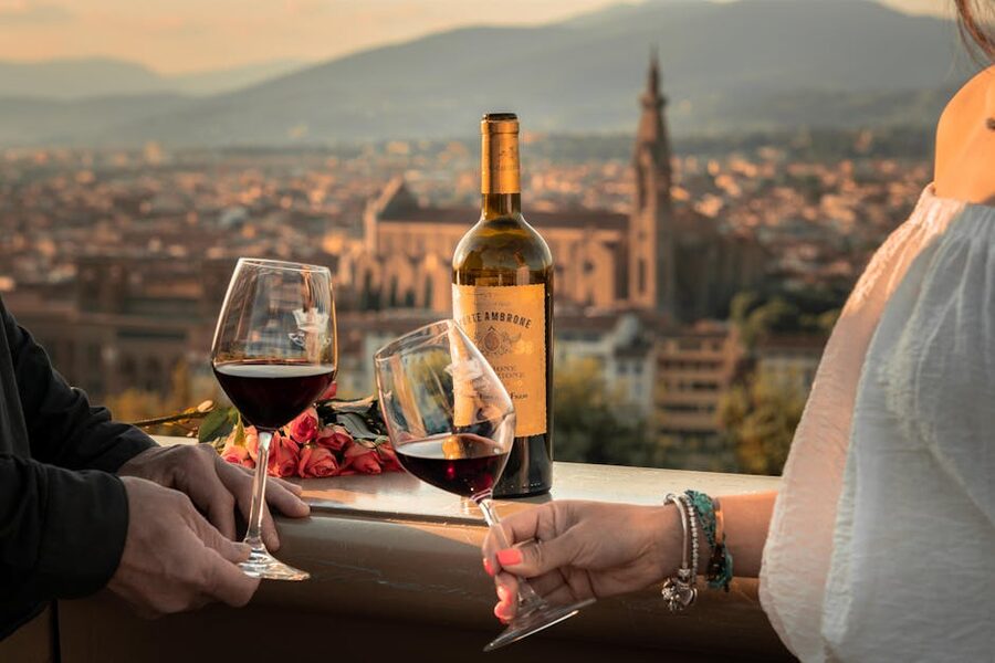 Wine toast at sunset with Tuscan view