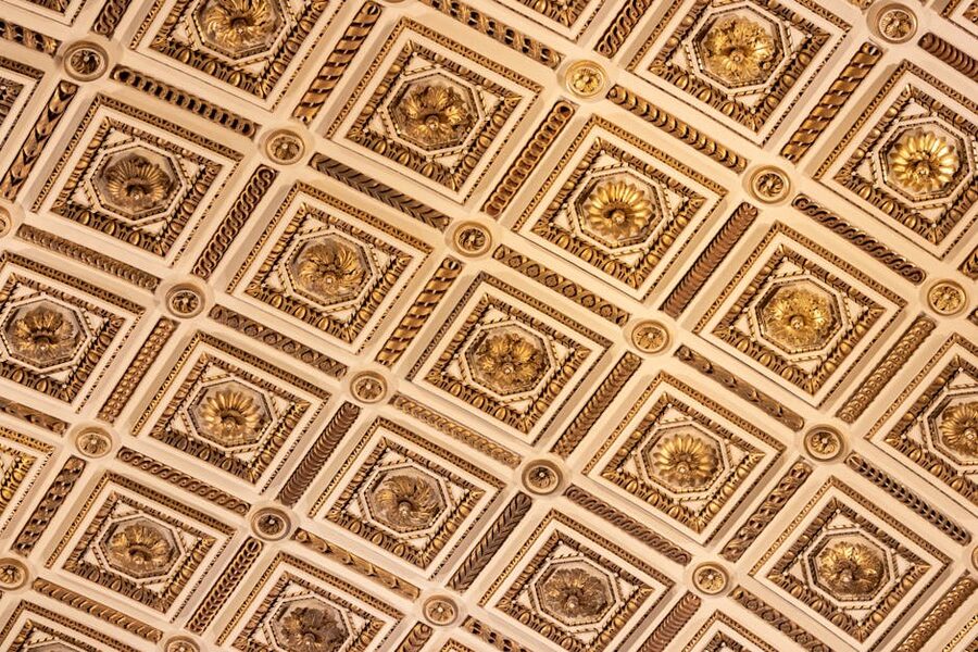 Ornate gold and white ceiling at the Uffizi Florence