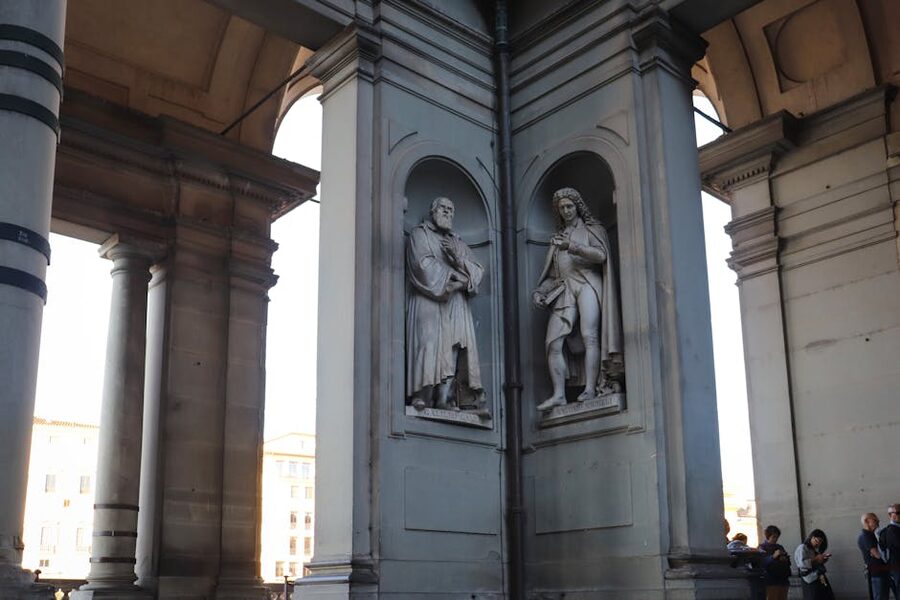 Renaissance statues lining the Uffizi exterior Florence