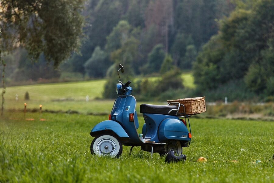 Vespa scooter on Italian countryside road