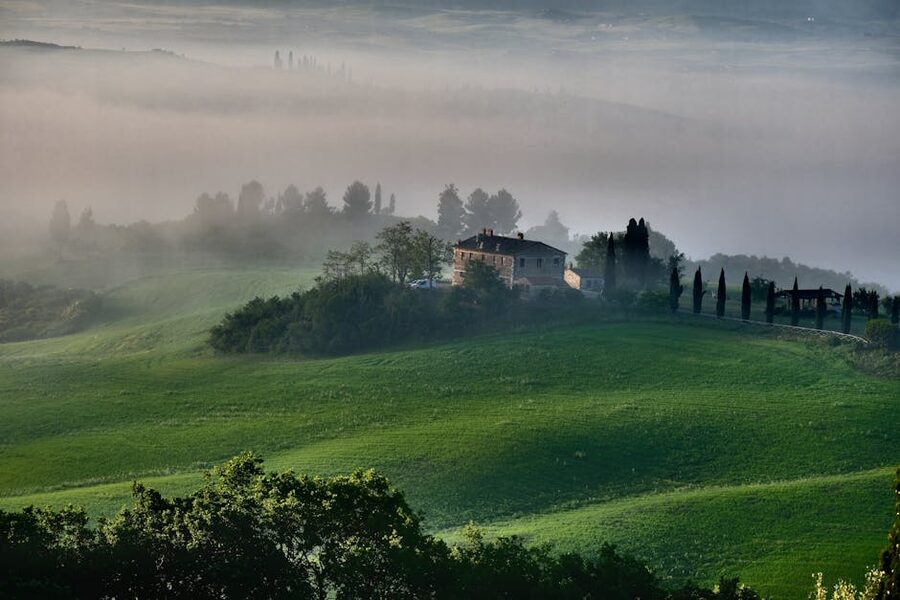 Misty Tuscan landscape with farmhouse