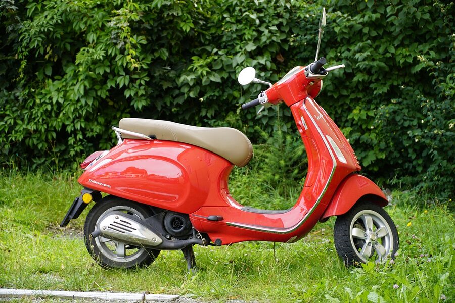 Red Vespa Primavera Italian classic scooter