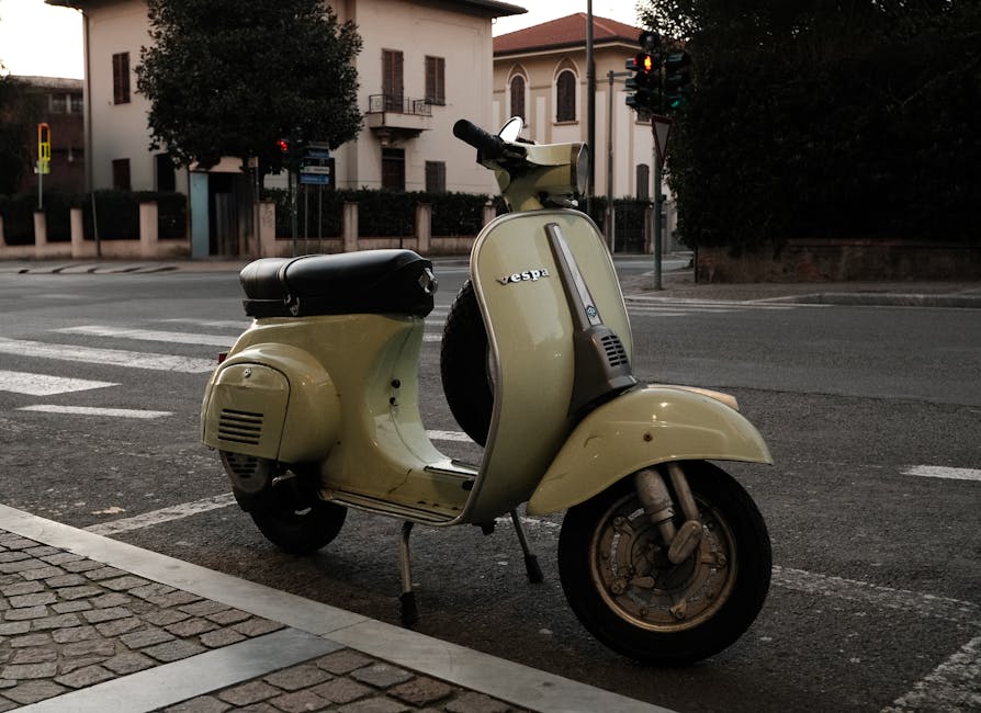 Classic Vespa parked on a Tuscan street