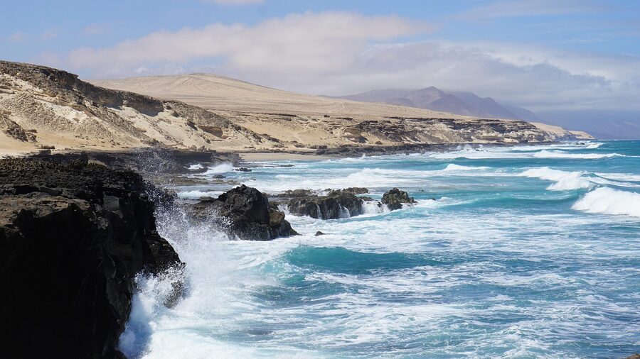 Rocky coast and cliffs of Fuerteventura with windy ocean conditions