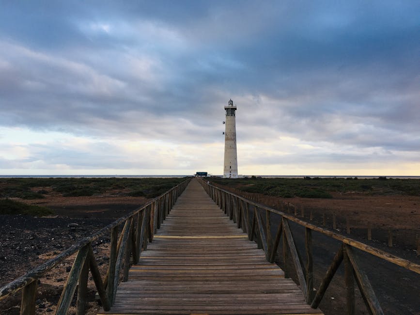 Wooden walkway leading to Faro de Morro Jable lighthouse on the Jandia peninsula, Fuerteventura