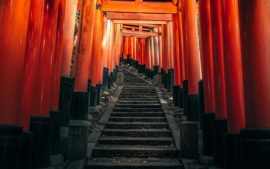 Pathway lined with red torii gates at Fushimi Inari Shrine in Kyoto