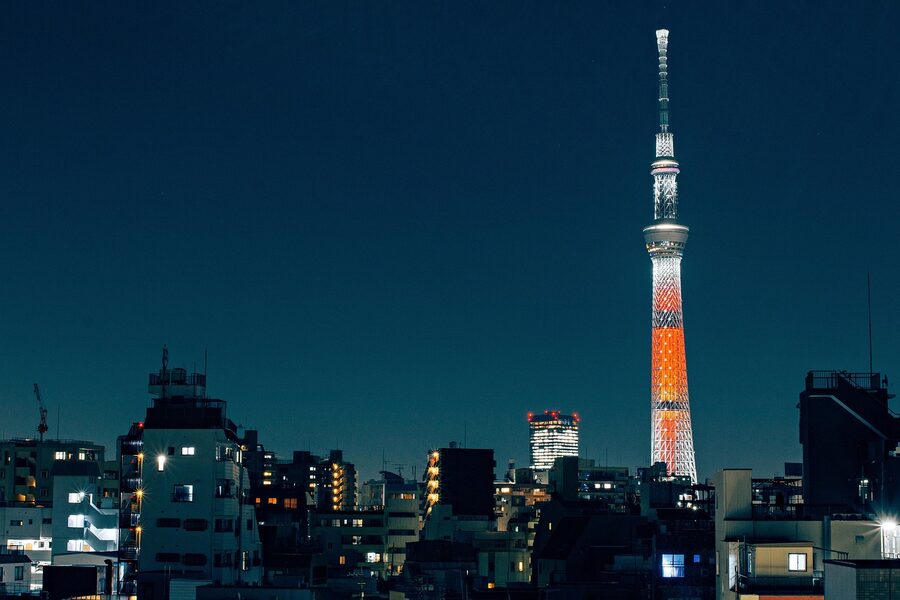 Tokyo Skytree tower lit up against the night sky in Tokyo Japan