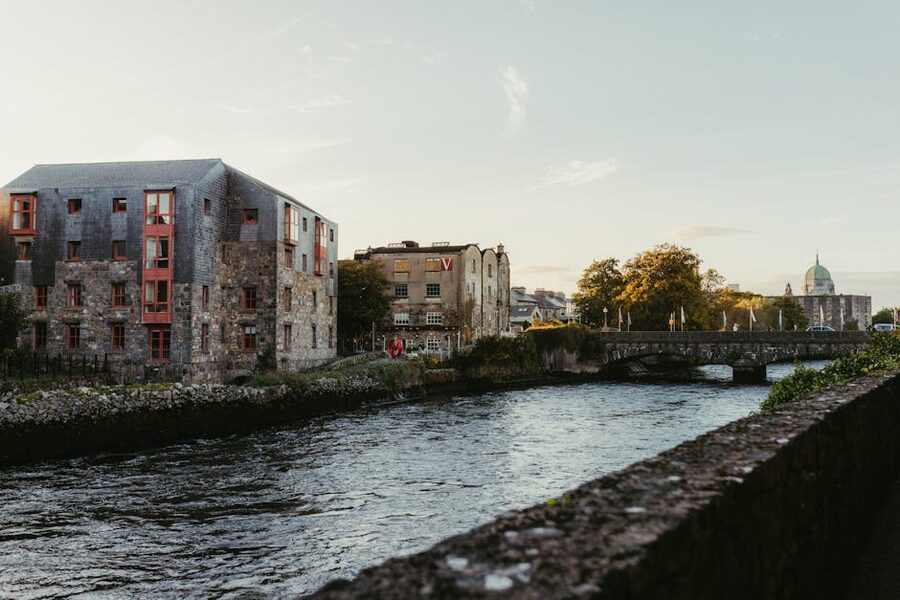 Galway river view at sunset with historic buildings