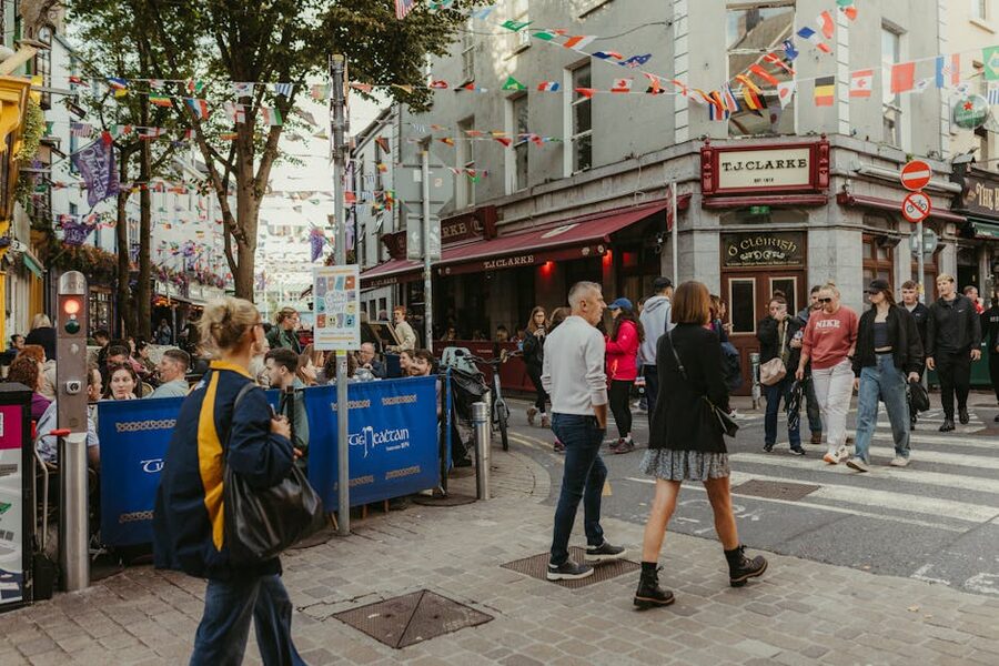 Galway street with flags and pedestrians