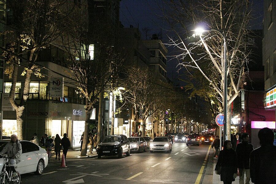Garosu-gil Gangnam at night with glowing storefronts
