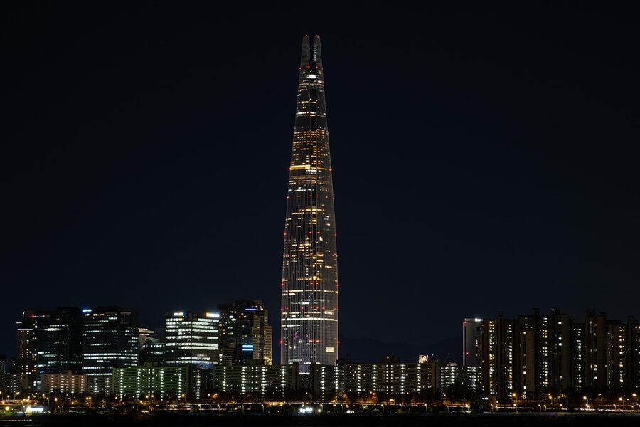 Lotte Tower at night in Seoul with city lights