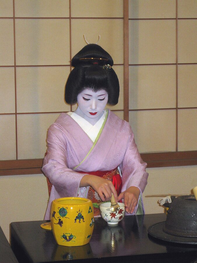 Geiko conducting a traditional tea ceremony in Kyoto