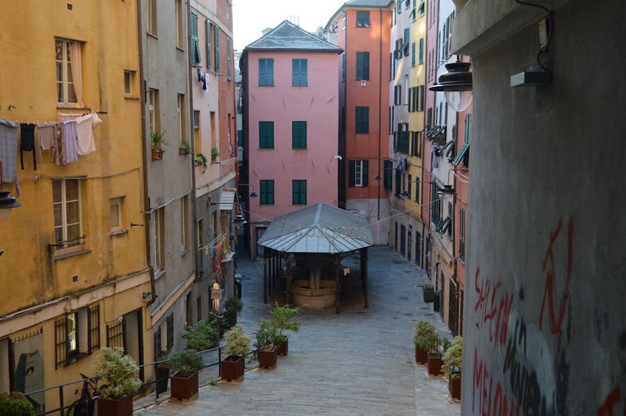 Narrow caruggi alley in Genoa with hanging laundry