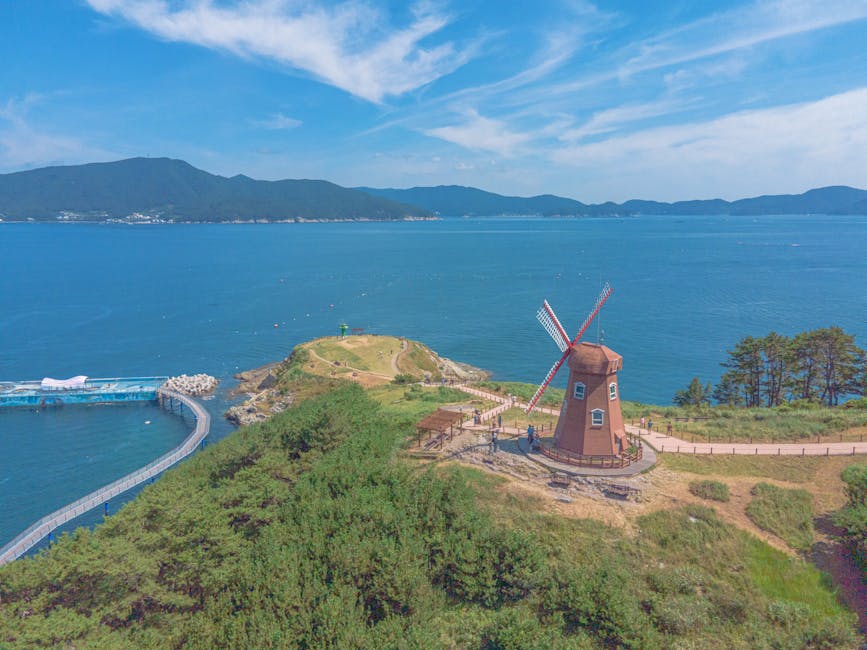 Aerial view of Windy Hill windmill overlooking the coast in Geoje-si, South Korea