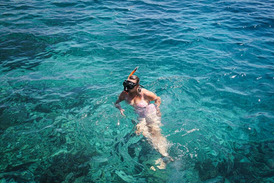 Woman snorkeling in the clear turquoise water of East Nusa Tenggara Indonesia