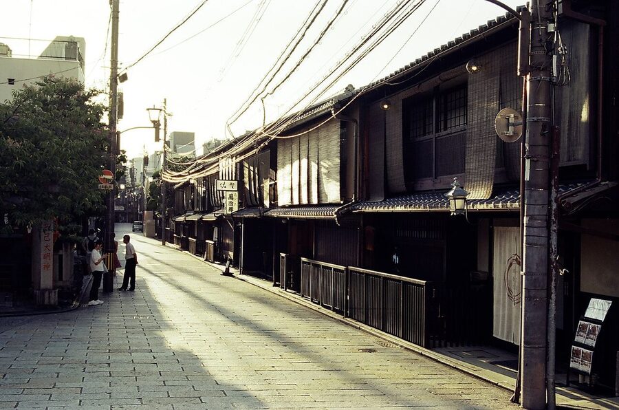 Street view of the Gion neighborhood in Kyoto showing traditional buildings