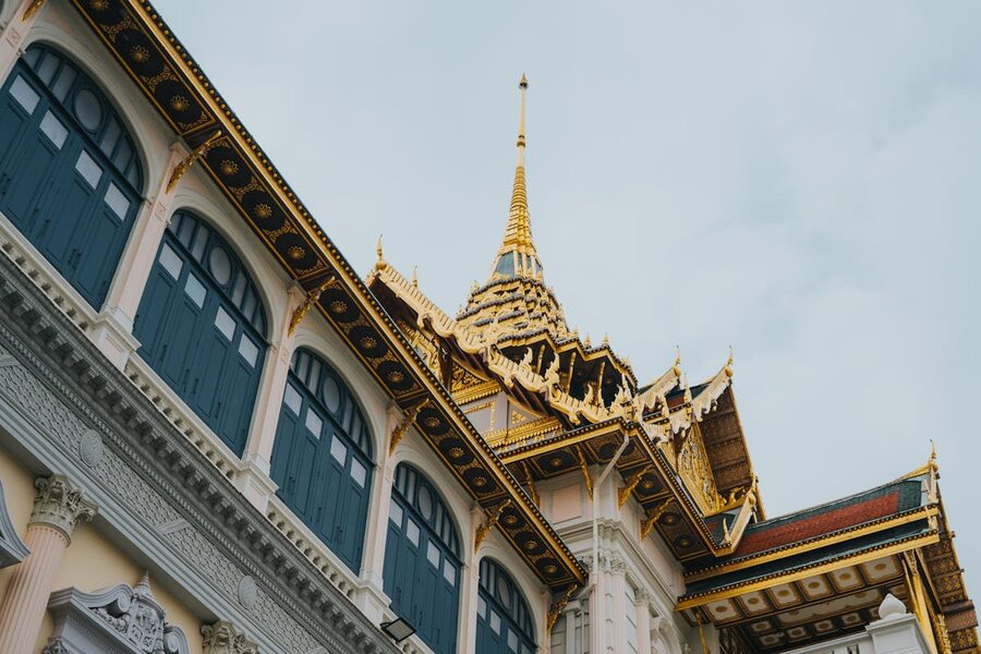 Detailed view of Grand Palace facade showing fusion of European and Thai architecture in Bangkok