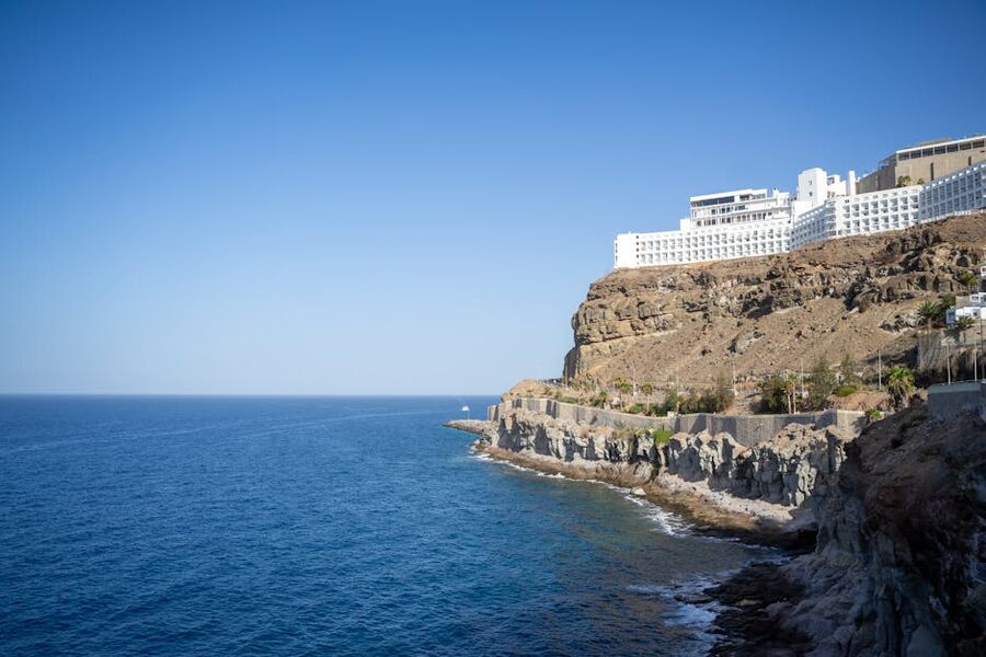 Coastal cliffs and hotel in Puerto Rico Gran Canaria