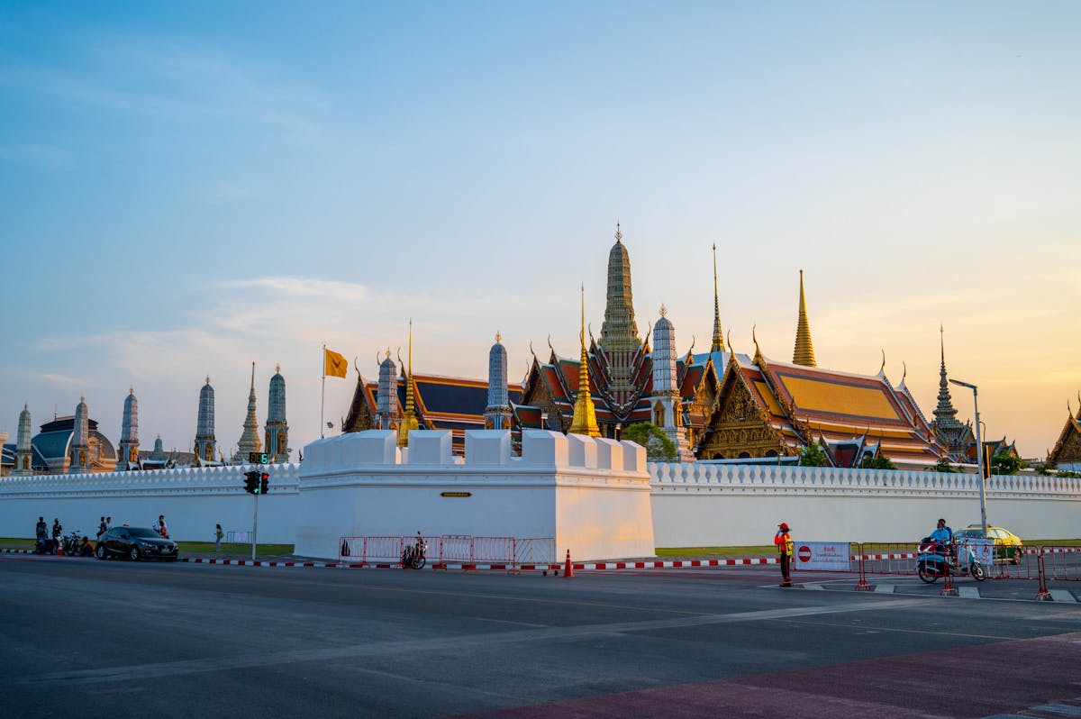 Grand Palace Bangkok with traditional Thai architecture during sunset