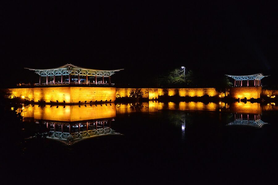 Anapji palace pond reflecting traditional roofs at night Gyeongju