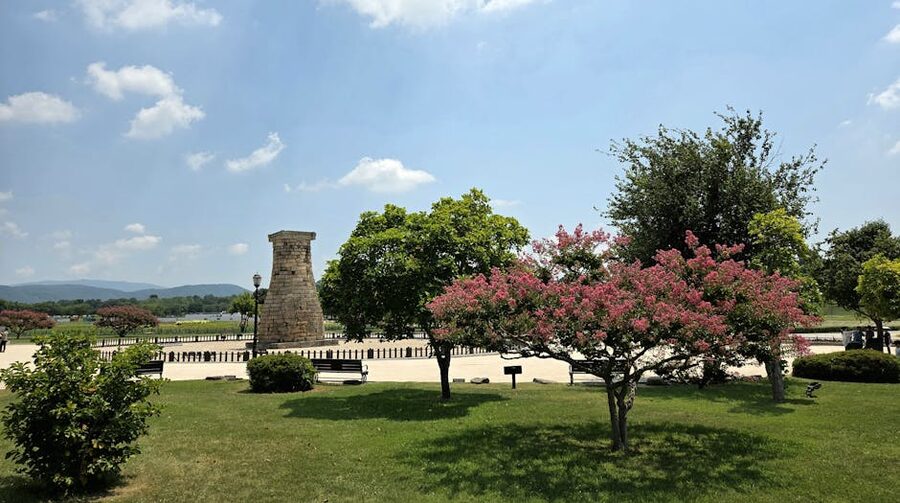 Cheomseongdae ancient stone observatory in Gyeongju surrounded by autumn trees