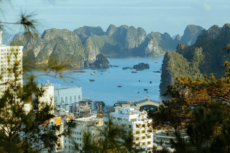 Aerial view of Halong Bay showing limestone formations and city