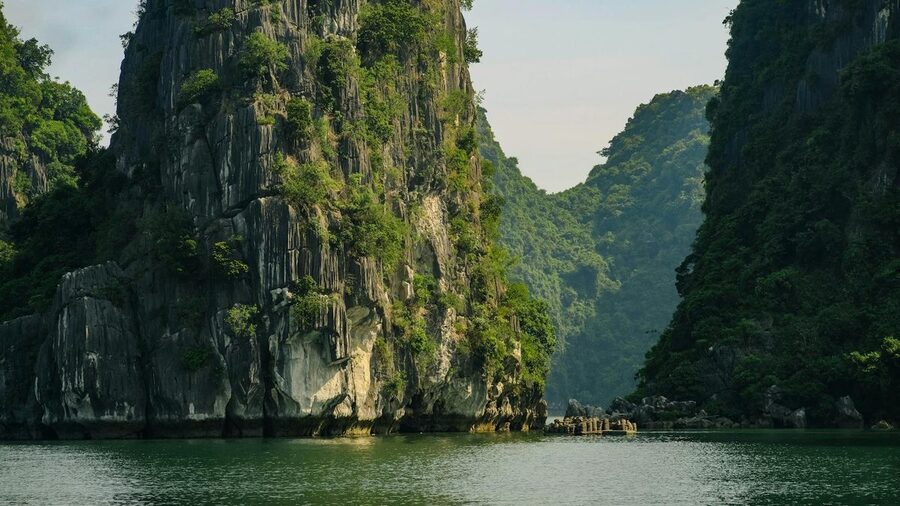 Dramatic limestone cliffs and emerald waters in Halong Bay