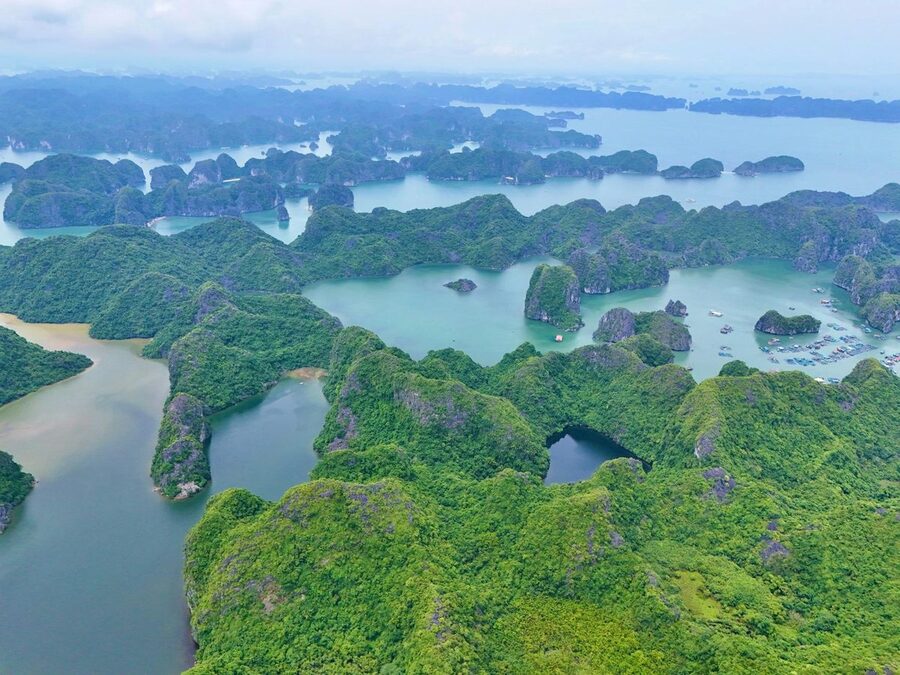 Aerial shot of lush green islands in Lan Ha Bay Vietnam