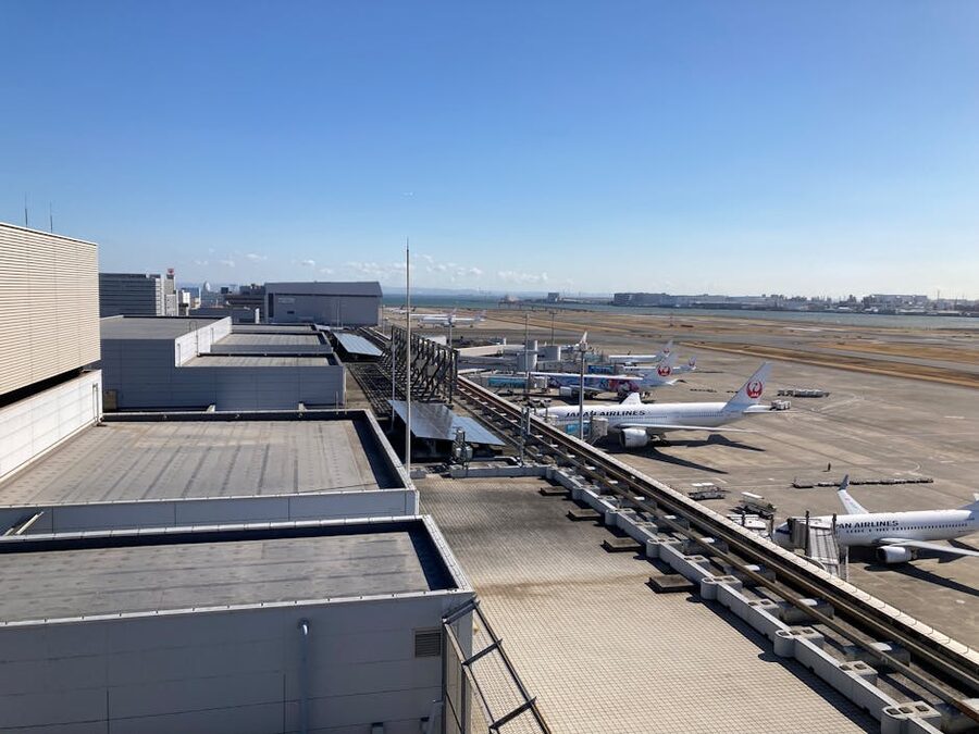 Aerial view of Haneda Airport with airplanes parked at terminal gates