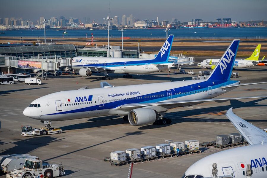 ANA Boeing 777 at Haneda Airport with city skyline