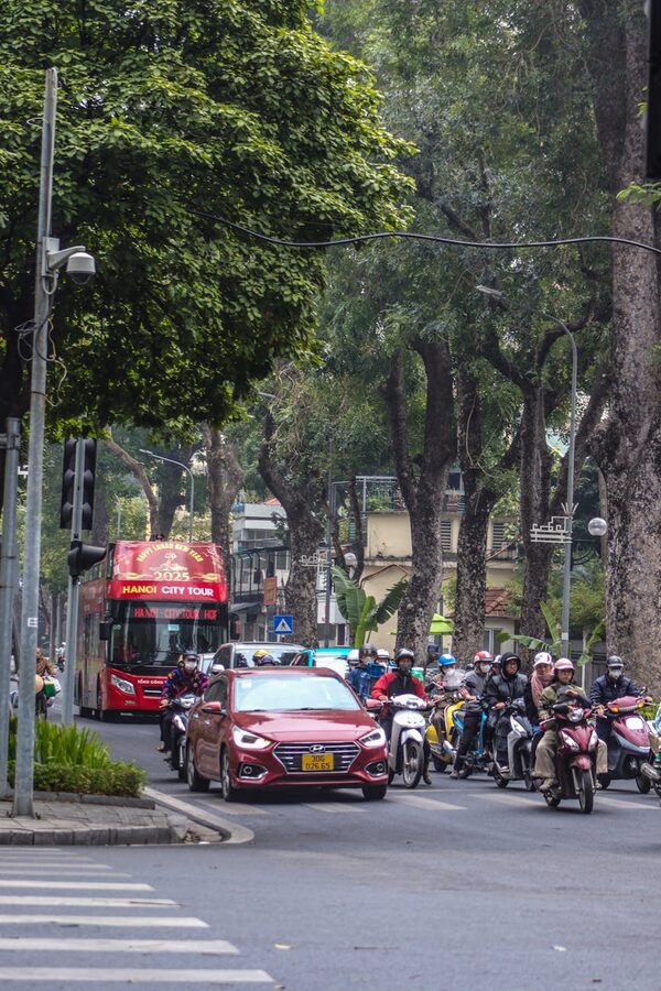 Busy city traffic with buses and motorbikes in Hanoi