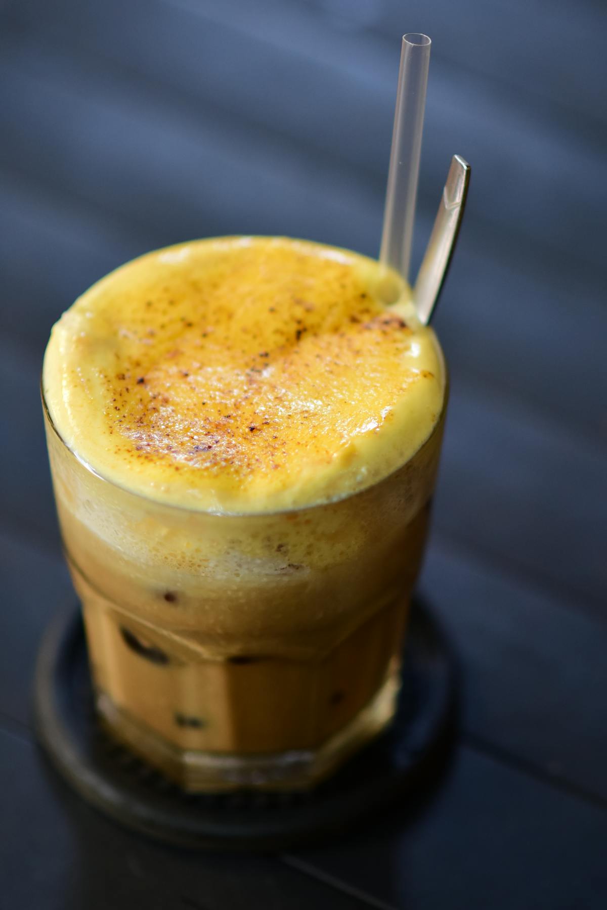 Cup of Hanoi egg coffee ca phe trung with creamy foam on top